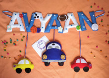 Load image into Gallery viewer, Personalized name bunting. Name bunting for nursery. Name bunting for bedroom. Felt name bunting. Children name bunting. Handmade gifts. Handmade bunting. Personalized décor. Nursery decoration. Nursery ideas. Moon wall décor. Moon wall hanging. Pastel Wall décor. Coat Mobile. Transport Theme Name Bunting. Car Name Bunting