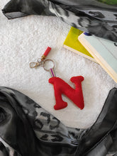 Load image into Gallery viewer, Key ring bag charm. Cute bag charm with stuffed alphabet. Hand bag charms. Felt bag charm. Unusual bag charm. Pink bag charm. Bag charm with lobster claw clip. Luxury bag charm. Tessel bag charm.