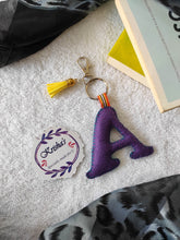 Load image into Gallery viewer, Key ring bag charm. Cute bag charm with stuffed alphabet. Hand bag charms. Felt bag charm. Unusual bag charm. Pink bag charm. Bag charm with lobster claw clip. Luxury bag charm. Tessel bag charm.