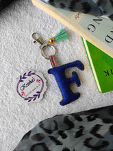 Load image into Gallery viewer, Key ring bag charm. Cute bag charm with stuffed alphabet. Hand bag charms. Felt bag charm. Unusual bag charm. Pink bag charm. Bag charm with lobster claw clip. Luxury bag charm. Tessel bag charm.