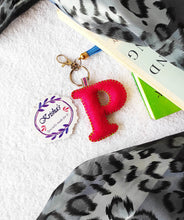 Load image into Gallery viewer, Key ring bag charm. Cute bag charm with stuffed alphabet. Hand bag charms. Felt bag charm. Unusual bag charm. Pink bag charm. Bag charm with lobster claw clip. Luxury bag charm. Tessel bag charm.