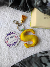 Load image into Gallery viewer, Key ring bag charm. Cute bag charm with stuffed alphabet. Hand bag charms. Felt bag charm. Unusual bag charm. Pink bag charm. Bag charm with lobster claw clip. Luxury bag charm. Tessel bag charm.