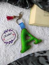 Load image into Gallery viewer, Key ring bag charm. Cute bag charm with stuffed alphabet. Hand bag charms. Felt bag charm. Unusual bag charm. Pink bag charm. Bag charm with lobster claw clip. Luxury bag charm. Tessel bag charm.