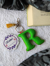 Load image into Gallery viewer, Key ring bag charm. Cute bag charm with stuffed alphabet. Hand bag charms. Felt bag charm. Unusual bag charm. Pink bag charm. Bag charm with lobster claw clip. Luxury bag charm. Tessel bag charm.