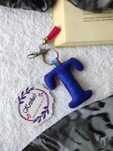 Load image into Gallery viewer, Key ring bag charm. Cute bag charm with stuffed alphabet. Hand bag charms. Felt bag charm. Unusual bag charm. Pink bag charm. Bag charm with lobster claw clip. Luxury bag charm. Tessel bag charm.