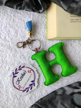 Load image into Gallery viewer, Key ring bag charm. Cute bag charm with stuffed alphabet. Hand bag charms. Felt bag charm. Unusual bag charm. Pink bag charm. Bag charm with lobster claw clip. Luxury bag charm. Tessel bag charm.