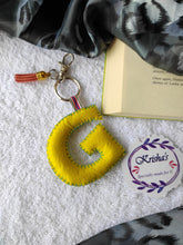 Load image into Gallery viewer, Key ring bag charm. Cute bag charm with stuffed alphabet. Hand bag charms. Felt bag charm. Unusual bag charm. Pink bag charm. Bag charm with lobster claw clip. Luxury bag charm. Tessel bag charm.