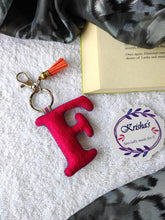 Load image into Gallery viewer, Key ring bag charm. Cute bag charm with stuffed alphabet. Hand bag charms. Felt bag charm. Unusual bag charm. Pink bag charm. Bag charm with lobster claw clip. Luxury bag charm. Tessel bag charm.