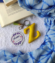 Load image into Gallery viewer, Key ring bag charm. Cute bag charm with stuffed alphabet. Hand bag charms. Felt bag charm. Unusual bag charm. Pink bag charm. Bag charm with lobster claw clip. Luxury bag charm. Tessel bag charm.