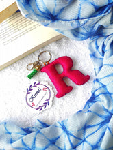 Load image into Gallery viewer, Key ring bag charm. Cute bag charm with stuffed alphabet. Hand bag charms. Felt bag charm. Unusual bag charm. Pink bag charm. Bag charm with lobster claw clip. Luxury bag charm. Tessel bag charm.