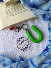 Load image into Gallery viewer, Key ring bag charm. Cute bag charm with stuffed alphabet. Hand bag charms. Felt bag charm. Unusual bag charm. Pink bag charm. Bag charm with lobster claw clip. Luxury bag charm. Tessel bag charm.