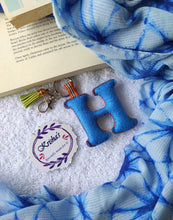 Load image into Gallery viewer, Key ring bag charm. Cute bag charm with stuffed alphabet. Hand bag charms. Felt bag charm. Unusual bag charm. Pink bag charm. Bag charm with lobster claw clip. Luxury bag charm. Tessel bag charm.