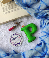 Load image into Gallery viewer, Key ring bag charm. Cute bag charm with stuffed alphabet. Hand bag charms. Felt bag charm. Unusual bag charm. Pink bag charm. Bag charm with lobster claw clip. Luxury bag charm. Tessel bag charm.