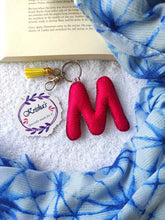 Load image into Gallery viewer, Key ring bag charm. Cute bag charm with stuffed alphabet. Hand bag charms. Felt bag charm. Unusual bag charm. Pink bag charm. Bag charm with lobster claw clip. Luxury bag charm. Tessel bag charm.