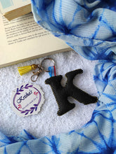 Load image into Gallery viewer, Key ring bag charm. Cute bag charm with stuffed alphabet. Hand bag charms. Felt bag charm. Unusual bag charm. Pink bag charm. Bag charm with lobster claw clip. Luxury bag charm. Tessel bag charm.