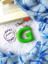 Load image into Gallery viewer, Key ring bag charm. Cute bag charm with stuffed alphabet. Hand bag charms. Felt bag charm. Unusual bag charm. Pink bag charm. Bag charm with lobster claw clip. Luxury bag charm. Tessel bag charm.