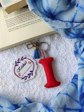 Load image into Gallery viewer, Key ring bag charm. Cute bag charm with stuffed alphabet. Hand bag charms. Felt bag charm. Unusual bag charm. Pink bag charm. Bag charm with lobster claw clip. Luxury bag charm. Tessel bag charm.