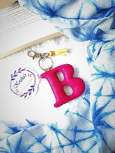 Load image into Gallery viewer, Key ring bag charm. Cute bag charm with stuffed alphabet. Hand bag charms. Felt bag charm. Unusual bag charm. Pink bag charm. Bag charm with lobster claw clip. Luxury bag charm. Tessel bag charm.