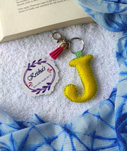 Load image into Gallery viewer, Key ring bag charm. Cute bag charm with stuffed alphabet. Hand bag charms. Felt bag charm. Unusual bag charm. Pink bag charm. Bag charm with lobster claw clip. Luxury bag charm. Tessel bag charm.