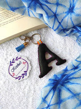 Load image into Gallery viewer, Key ring bag charm. Cute bag charm with stuffed alphabet. Hand bag charms. Felt bag charm. Unusual bag charm. Pink bag charm. Bag charm with lobster claw clip. Luxury bag charm. Tessel bag charm.