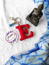 Load image into Gallery viewer, Key ring bag charm. Cute bag charm with stuffed alphabet. Hand bag charms. Felt bag charm. Unusual bag charm. Pink bag charm. Bag charm with lobster claw clip. Luxury bag charm. Tessel bag charm.