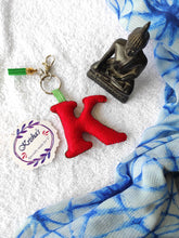 Load image into Gallery viewer, Key ring bag charm. Cute bag charm with stuffed alphabet. Hand bag charms. Felt bag charm. Unusual bag charm. Pink bag charm. Bag charm with lobster claw clip. Luxury bag charm. Tessel bag charm.