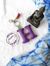 Load image into Gallery viewer, Key ring bag charm. Cute bag charm with stuffed alphabet. Hand bag charms. Felt bag charm. Unusual bag charm. Pink bag charm. Bag charm with lobster claw clip. Luxury bag charm. Tessel bag charm.