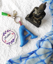 Load image into Gallery viewer, Key ring bag charm. Cute bag charm with stuffed alphabet. Hand bag charms. Felt bag charm. Unusual bag charm. Pink bag charm. Bag charm with lobster claw clip. Luxury bag charm. Tessel bag charm.