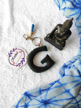 Load image into Gallery viewer, Key ring bag charm. Cute bag charm with stuffed alphabet. Hand bag charms. Felt bag charm. Unusual bag charm. Pink bag charm. Bag charm with lobster claw clip. Luxury bag charm. Tessel bag charm.