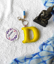 Load image into Gallery viewer, Key ring bag charm. Cute bag charm with stuffed alphabet. Hand bag charms. Felt bag charm. Unusual bag charm. Pink bag charm. Bag charm with lobster claw clip. Luxury bag charm. Tessel bag charm.