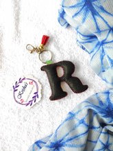 Load image into Gallery viewer, Key ring bag charm. Cute bag charm with stuffed alphabet. Hand bag charms. Felt bag charm. Unusual bag charm. Pink bag charm. Bag charm with lobster claw clip. Luxury bag charm. Tessel bag charm.