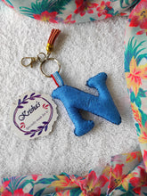 Load image into Gallery viewer, Key ring bag charm. Cute bag charm with stuffed alphabet. Hand bag charms. Felt bag charm. Unusual bag charm. Pink bag charm. Bag charm with lobster claw clip. Luxury bag charm. Tessel bag charm.