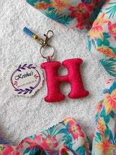 Load image into Gallery viewer, Key ring bag charm. Cute bag charm with stuffed alphabet. Hand bag charms. Felt bag charm. Unusual bag charm. Pink bag charm. Bag charm with lobster claw clip. Luxury bag charm. Tessel bag charm.