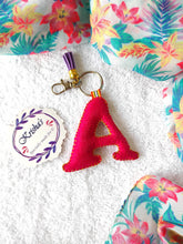 Load image into Gallery viewer, Key ring bag charm. Cute bag charm with stuffed alphabet. Hand bag charms. Felt bag charm. Unusual bag charm. Pink bag charm. Bag charm with lobster claw clip. Luxury bag charm. Tessel bag charm.