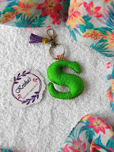 Load image into Gallery viewer, Key ring bag charm. Cute bag charm with stuffed alphabet. Hand bag charms. Felt bag charm. Unusual bag charm. Pink bag charm. Bag charm with lobster claw clip. Luxury bag charm. Tessel bag charm.
