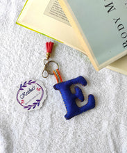 Load image into Gallery viewer, Key ring bag charm. Cute bag charm with stuffed alphabet. Hand bag charms. Felt bag charm. Unusual bag charm. Pink bag charm. Bag charm with lobster claw clip. Luxury bag charm. Tessel bag charm.