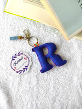 Load image into Gallery viewer, Key ring bag charm. Cute bag charm with stuffed alphabet. Hand bag charms. Felt bag charm. Unusual bag charm. Pink bag charm. Bag charm with lobster claw clip. Luxury bag charm. Tessel bag charm.