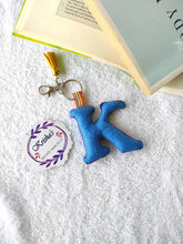 Load image into Gallery viewer, Key ring bag charm. Cute bag charm with stuffed alphabet. Hand bag charms. Felt bag charm. Unusual bag charm. Pink bag charm. Bag charm with lobster claw clip. Luxury bag charm. Tessel bag charm.