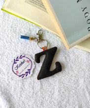 Load image into Gallery viewer, Key ring bag charm. Cute bag charm with stuffed alphabet. Hand bag charms. Felt bag charm. Unusual bag charm. Pink bag charm. Bag charm with lobster claw clip. Luxury bag charm. Tessel bag charm.