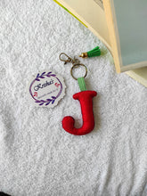 Load image into Gallery viewer, Key ring bag charm. Cute bag charm with stuffed alphabet. Hand bag charms. Felt bag charm. Unusual bag charm. Pink bag charm. Bag charm with lobster claw clip. Luxury bag charm. Tessel bag charm.