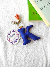 Load image into Gallery viewer, Key ring bag charm. Cute bag charm with stuffed alphabet. Hand bag charms. Felt bag charm. Unusual bag charm. Pink bag charm. Bag charm with lobster claw clip. Luxury bag charm. Tessel bag charm.