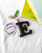 Load image into Gallery viewer, Key ring bag charm. Cute bag charm with stuffed alphabet. Hand bag charms. Felt bag charm. Unusual bag charm. Pink bag charm. Bag charm with lobster claw clip. Luxury bag charm. Tessel bag charm.