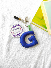 Load image into Gallery viewer, Key ring bag charm. Cute bag charm with stuffed alphabet. Hand bag charms. Felt bag charm. Unusual bag charm. Pink bag charm. Bag charm with lobster claw clip. Luxury bag charm. Tessel bag charm.