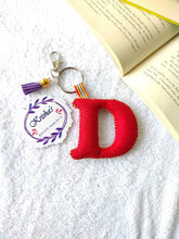 Load image into Gallery viewer, Key ring bag charm. Cute bag charm with stuffed alphabet. Hand bag charms. Felt bag charm. Unusual bag charm. Pink bag charm. Bag charm with lobster claw clip. Luxury bag charm. Tessel bag charm.