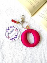 Load image into Gallery viewer, Key ring bag charm. Cute bag charm with stuffed alphabet. Hand bag charms. Felt bag charm. Unusual bag charm. Pink bag charm. Bag charm with lobster claw clip. Luxury bag charm. Tessel bag charm.