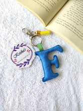 Load image into Gallery viewer, Key ring bag charm. Cute bag charm with stuffed alphabet. Hand bag charms. Felt bag charm. Unusual bag charm. Pink bag charm. Bag charm with lobster claw clip. Luxury bag charm. Tessel bag charm.