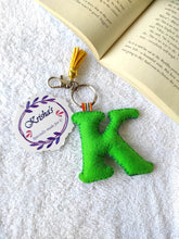 Load image into Gallery viewer, Key ring bag charm. Cute bag charm with stuffed alphabet. Hand bag charms. Felt bag charm. Unusual bag charm. Pink bag charm. Bag charm with lobster claw clip. Luxury bag charm. Tessel bag charm.