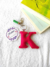 Load image into Gallery viewer, Key ring bag charm. Cute bag charm with stuffed alphabet. Hand bag charms. Felt bag charm. Unusual bag charm. Pink bag charm. Bag charm with lobster claw clip. Luxury bag charm. Tessel bag charm.