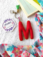 Load image into Gallery viewer, Key ring bag charm. Cute bag charm with stuffed alphabet. Hand bag charms. Felt bag charm. Unusual bag charm. Pink bag charm. Bag charm with lobster claw clip. Luxury bag charm. Tessel bag charm.