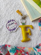 Load image into Gallery viewer, Key ring bag charm. Cute bag charm with stuffed alphabet. Hand bag charms. Felt bag charm. Unusual bag charm. Pink bag charm. Bag charm with lobster claw clip. Luxury bag charm. Tessel bag charm.